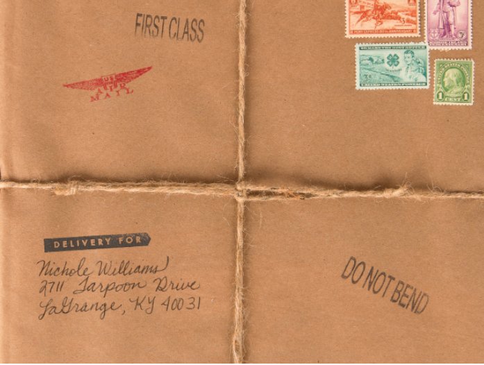 Hand-addressed brown paper parcel with vintage stamps — one of the campaign mailers